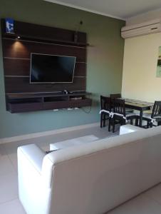 a living room with a flat screen tv on a wall at San Juan Santo Tome in Santo Tomé +8 photos