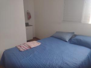 Postel nebo postele na pokoji v ubytování apto completo c garagem