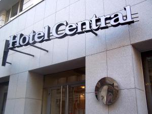 a hotel central sign on the side of a building at Central Hotel, Trademark Collection by Wyndham in Bucharest