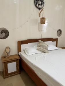 Postel nebo postele na pokoji v ubytování Maison Diop