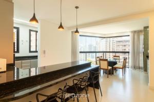 Et opholdsområde på Aptos em prédio a 90 m da praia de Perequê - RIHs