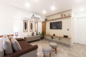 Et tv og/eller underholdning på Estadia completa com piscina e a 350m da Praia PRY