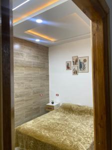 En eller flere senge i et værelse på Appartement Les Vagues Bleues