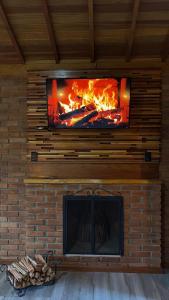 Et tv og/eller underholdning på Recanto João de barro