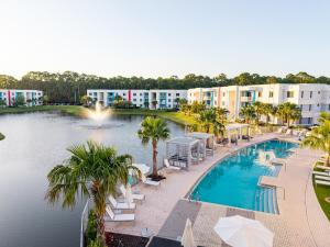 an image of a swimming pool at a resort at Spacious 3BR | Pool, Gym, Near Beach & Speedway in Daytona Beach