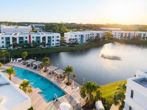 an aerial view of a hotel with a pool and buildings at Spacious 3BR | Pool, Gym, Near Beach & Speedway in Daytona Beach