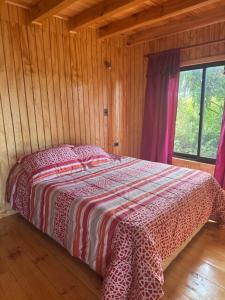 Giường trong phòng chung tại Cabaña Lago Ranco +15 ảnh