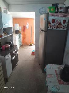a kitchen with a refrigerator in a room at Casa para alugar para o Carnaval in Recife