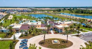 an aerial view of the resort with a parking lot at Spacious 9BR Home w Private PoolGame Room in Davenport