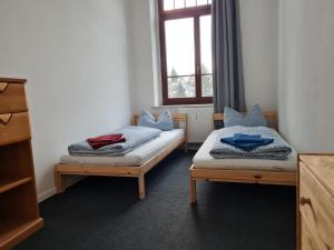 En eller flere senge i et værelse på Ausblick Freital 4