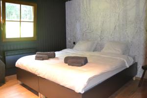 Postel nebo postele na pokoji v ubytování Chalet Le Forestier