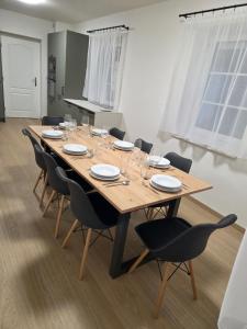 a conference room with a wooden table and chairs at Popelucha in Lomnice nad Popelkou