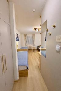 a small room with a bed and a desk at Konaci Prime Center in Kopaonik