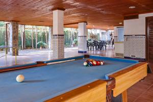 a pool table in the middle of a room at Finca Aquí Me Quedo in Murcia