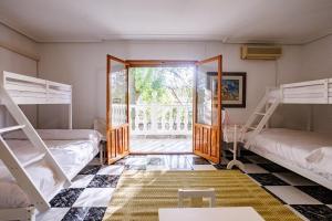 a room with four bunk beds and a doorway at Finca Aquí Me Quedo in Murcia +50 photos