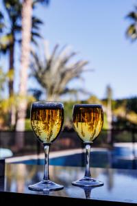 two glasses of white wine sitting on a table at Finca Aquí Me Quedo in Murcia