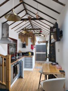 a kitchen with a table and a dining room at Zanders cave in Edwinstowe