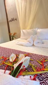 Giường trong phòng chung tại Casa Bio Arraial DAjuda