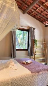 Giường trong phòng chung tại Casa Bio Arraial DAjuda