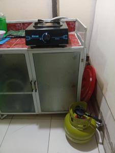 a counter with a stove on top of it at sarisare homestay 2BR in Bulakbenda +7 photos