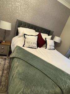 a bedroom with a bed with two pillows on it at Church view in Conisbrough