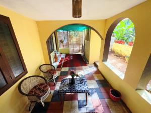 a view of a room with a table and chairs at Saralalayam in Varkala