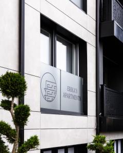 a sign on the side of a building at Erika's Apartments in Pristina