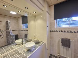 a bathroom with a sink and a mirror at Lierelodge in Oud-Turnhout +55 photos
