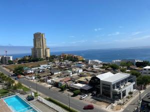 an aerial view of a city with a building at Dpto 2 dormitorios vista al mar in Concón