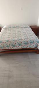 En eller flere senge i et værelse på Villa Adelaida