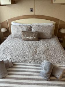 a large white bed with two pillows on it at Murphys in Brigham