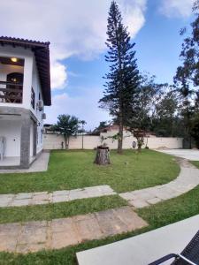 a tree in the yard of a house at Mansion in the mountains in Teresópolis