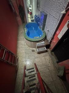 an overhead view of a bathroom with a tub at Hotel Pousada-LG in Breves