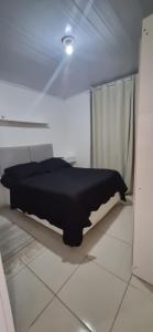 En eller flere senge i et værelse på Casa da Karin