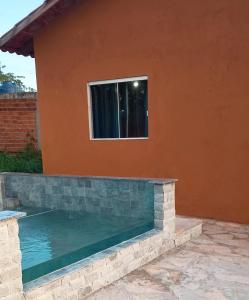 Swimmingpoolen hos eller tæt på Suíte master vila geovana