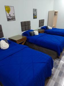 Postel nebo postele na pokoji v ubytování Mirra Mirzas Roomstay + 16 fotografií