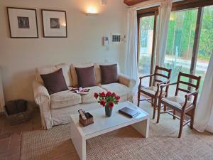 a living room with a couch and a table at Modern holiday home in Foligno - Loc with pool in Case Vecchie