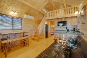 a living room and kitchen in a log cabin at Angel Fire RV Resort in Angel Fire