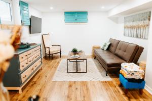 a living room with a couch and a table at The Bay Crib in Ottawa