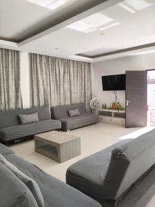 Khu vực ghế ngồi tại Casa Hannia 30 huéspedes Cerca de la playa Alberca +17 ảnh