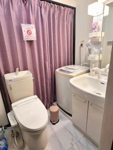 a bathroom with a toilet and a sink at Mori de house in kobe 1 in Kobe +12 photos