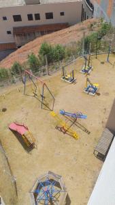 a group of play equipment in a playground at APTO EASY Poços de Caldas in Poços de Caldas