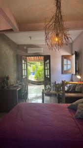 En eller flere senge i et værelse på Falésias de Carapibus