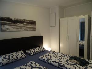 Giường trong phòng chung tại Fewo-Nordseeplatz +22 ảnh