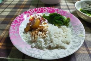 a plate of rice and vegetables on a table at Vila's Homestay in Kohīma +12 photos