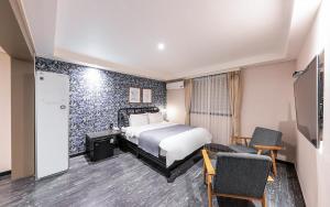 Postel nebo postele na pokoji v ubytování 브라운도트호텔 엄궁점