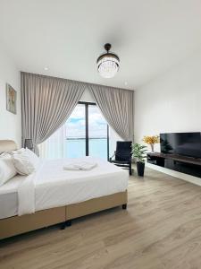 Postel nebo postele na pokoji v ubytování Marina View Resort - Johor