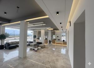 a lobby with couches and tables in a building at Avera luxurious stay in Igatpuri