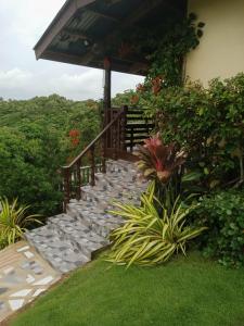 a set of stairs leading up to a house at Hilltop Cottage in Cabulihan +12 photos