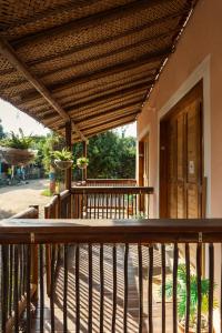 a wooden deck with awning on a house at Apartaestudio Privado con cocina in Palomino